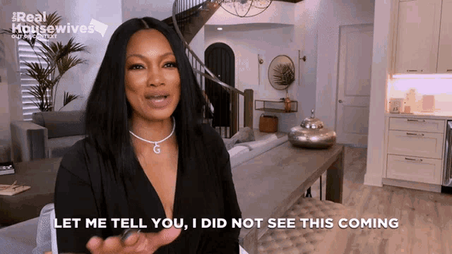 a woman says " let me tell you i did not see this coming " in front of a living room