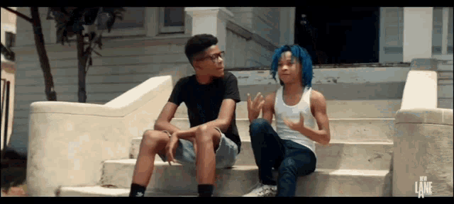 two boys sit on a set of stairs with the word lane on the bottom right