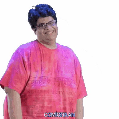 a man wearing glasses and a pink shirt that says comictaan on it