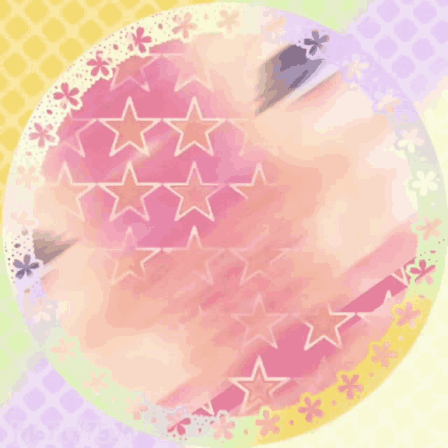 a pink circle with a pattern of stars and flowers around it