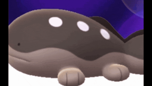 a cartoon whale with white dots on it 's face
