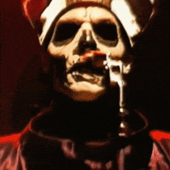 a skeleton is holding a gun in his mouth