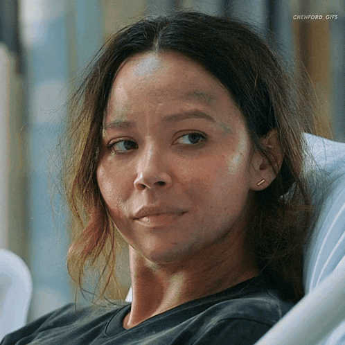 a woman is laying in a hospital bed with chienford_gifs written on the bottom