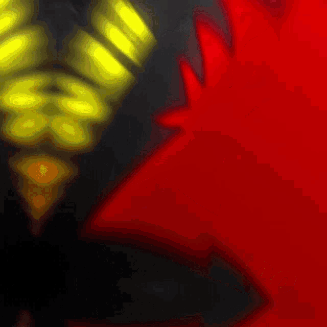 a close up of a red and yellow graphic