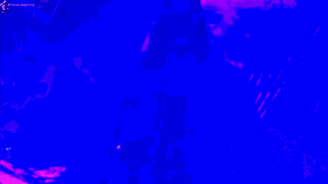 a man in a hat is standing in front of a purple and blue background