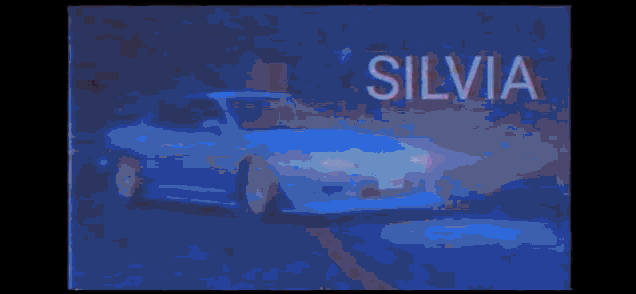 a car is driving down a highway at night and the date is october 26 1985 .