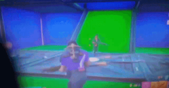 a blurry picture of a person in a video game with a green screen behind them