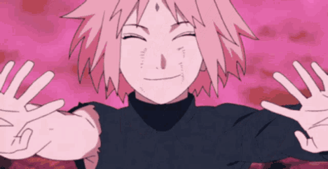 a girl with pink hair is smiling with her hands outstretched .