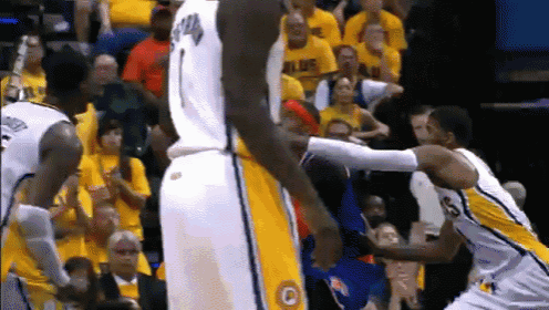 a basketball player wearing a white jersey with the letter p on it