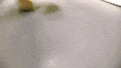 a blurred image of a person using a tablet computer