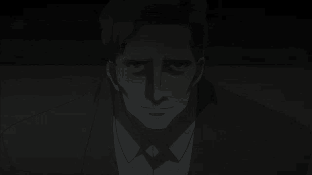 a man in a suit and tie with a shadow on his face