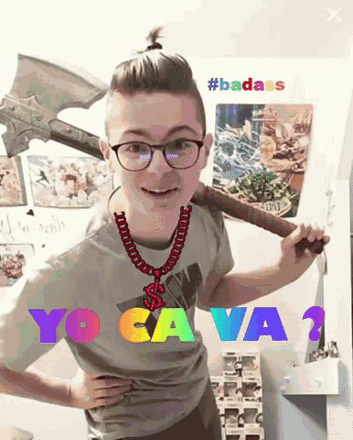 a boy wearing glasses and a necklace is holding a bat with the words yo ca va on it