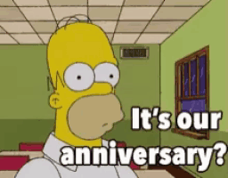 a cartoon of homer simpson says it 's our anniversary