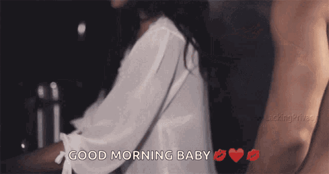 a man is kissing a woman with the words good morning baby written on the bottom