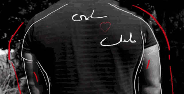 a man 's back has arabic writing on it