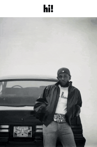 a black and white photo of a man standing in front of a car with the words hi on the bottom