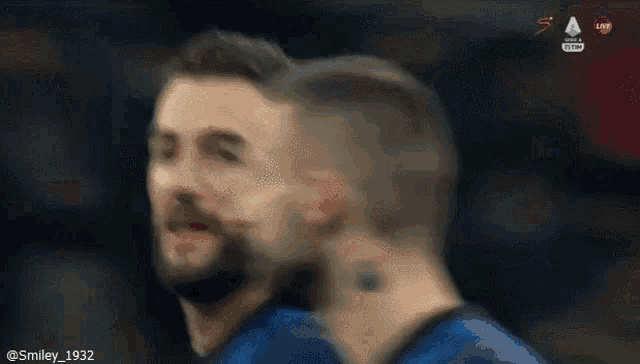 a blurry picture of a soccer player with the hashtag smiley_1932 at the bottom