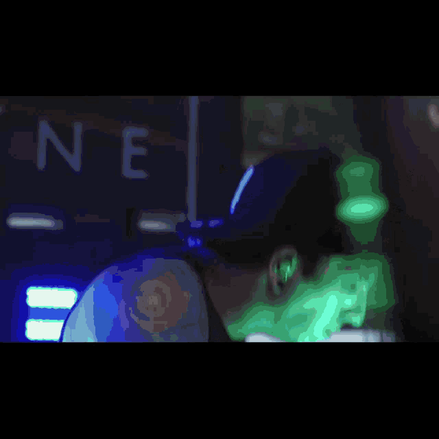 a blurry picture of a man 's face with the word ne visible in the background