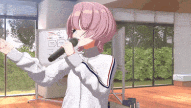 a girl with pink hair is singing into a microphone in front of a whiteboard that says ' a '