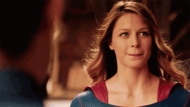 a woman in a blue and red superhero costume