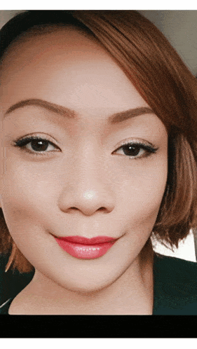 a closeup of a woman 's face with red lips