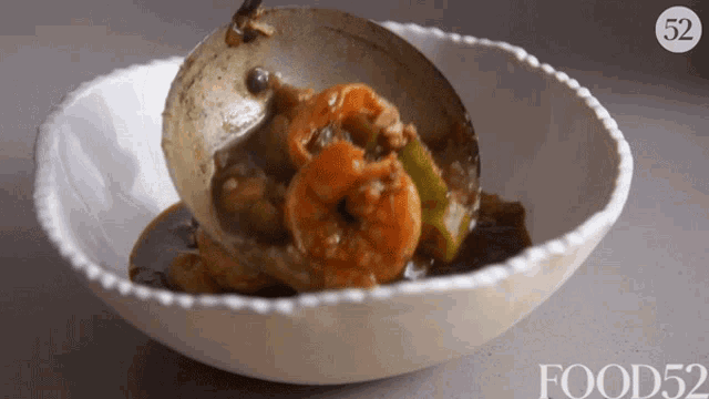 a bowl of food with the number 52 on the top