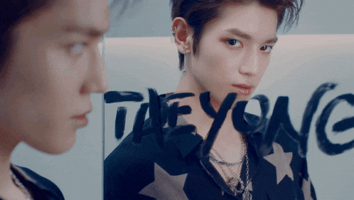 the word taeyong is painted on a glass