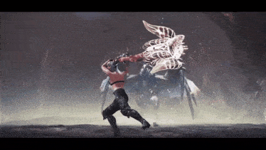 a man is fighting a monster in a video game while holding a sword .