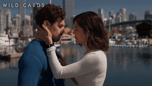 a poster for wild cards shows a couple kissing