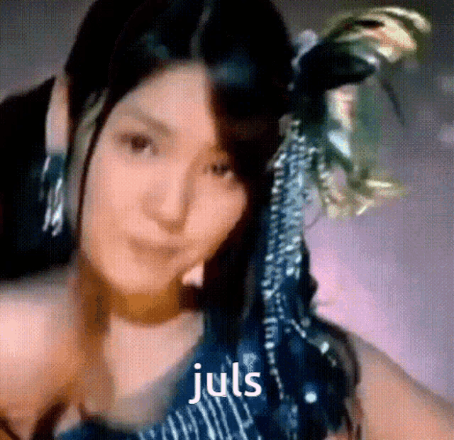 a close up of a woman 's face with the words juls written on the bottom