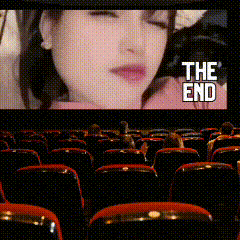 the end of a movie is shown on a screen in a theater
