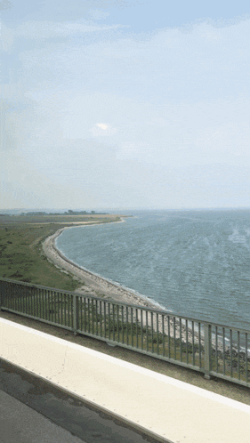 a view of a body of water from a bridge with the words shaga on the bottom right