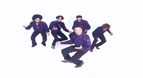 a group of men in purple shirts are dancing in a circle