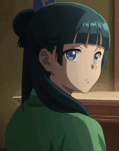 a close up of a girl with blue eyes and green hair