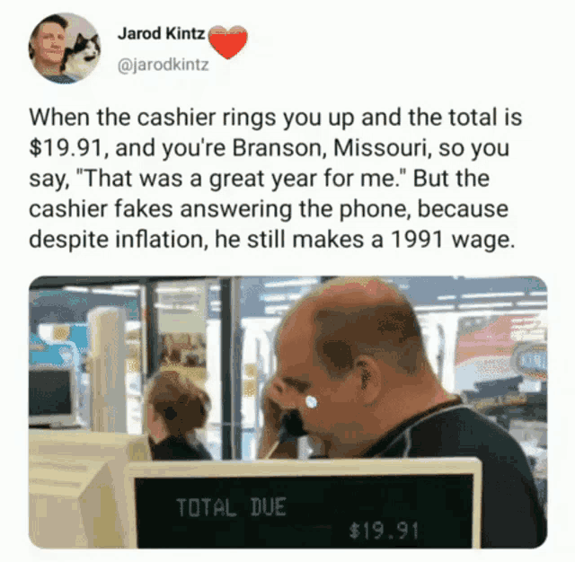 a man talking on a cell phone in front of a sign that says total due on it