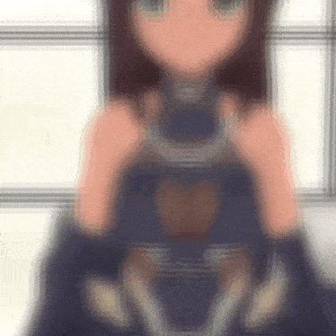 a blurry picture of a girl with a heart shaped chest
