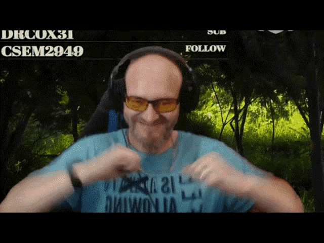 a man wearing headphones and a shirt that says ' drcox31 csem2049 ' on it