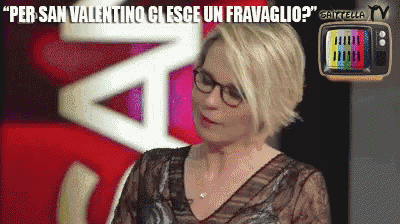 a woman wearing glasses says " per san valentino ci esce un fravaggio "
