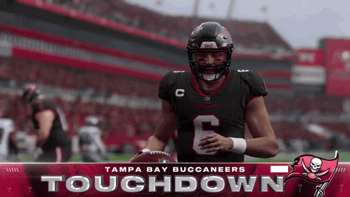 a tampa bay buccaneers football player is holding a football