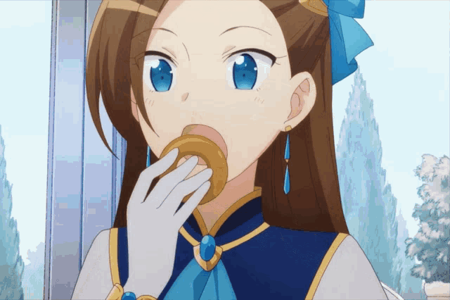 a girl with a blue bow on her head is eating a donut