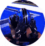 a football player is wearing a blue helmet and black gloves .