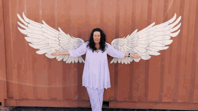 a woman with wings painted on a wall