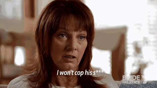 a woman sitting on a couch says i won 't cop his