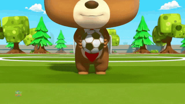 a teddy bear is holding a soccer ball on a field with trees in the background