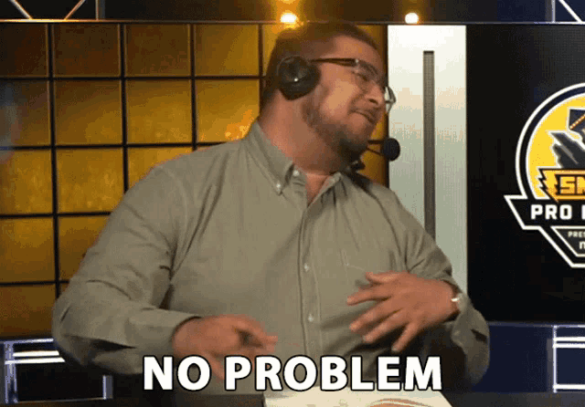 a man wearing a headset says no problem in front of a pro league logo