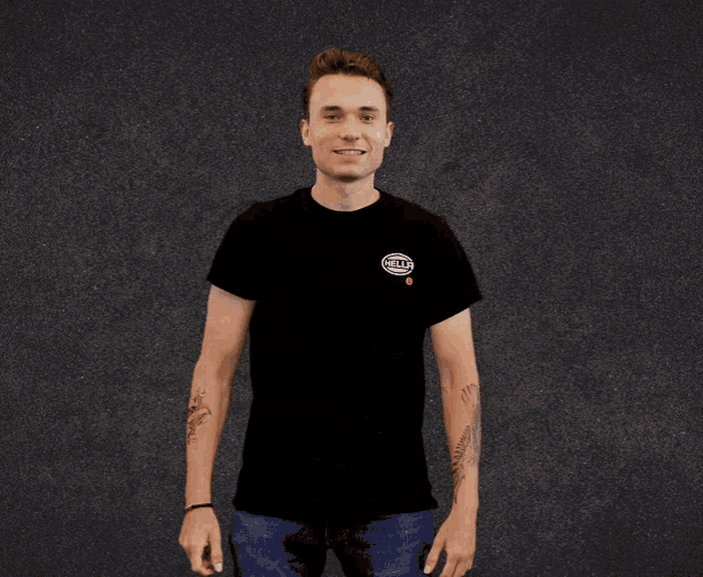a man wearing a black t-shirt with a circle that says gulf on it