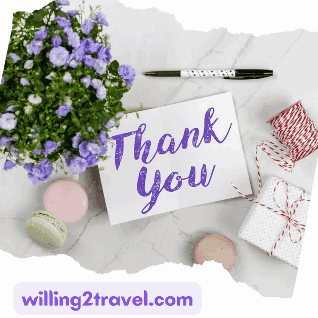 a thank you card with flowers and gifts in the background