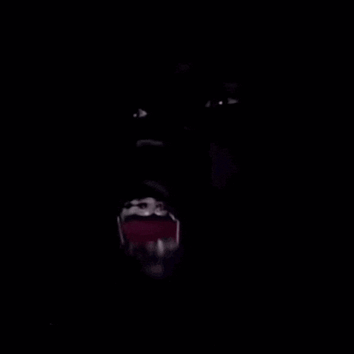 a close up of a person 's face with their tongue out .