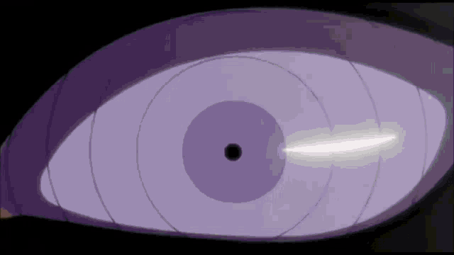 a close up of a person 's purple eye with a white light coming out of it .