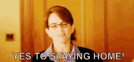 a woman wearing glasses says yes to staying home